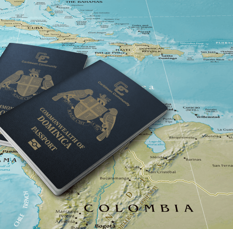 2 dominica passports on top of map