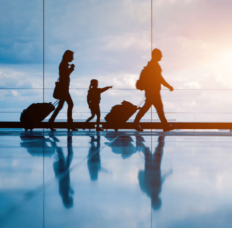 family walking down airport